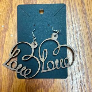 Hand made new.laser cut wood earrings and they are sterling silver